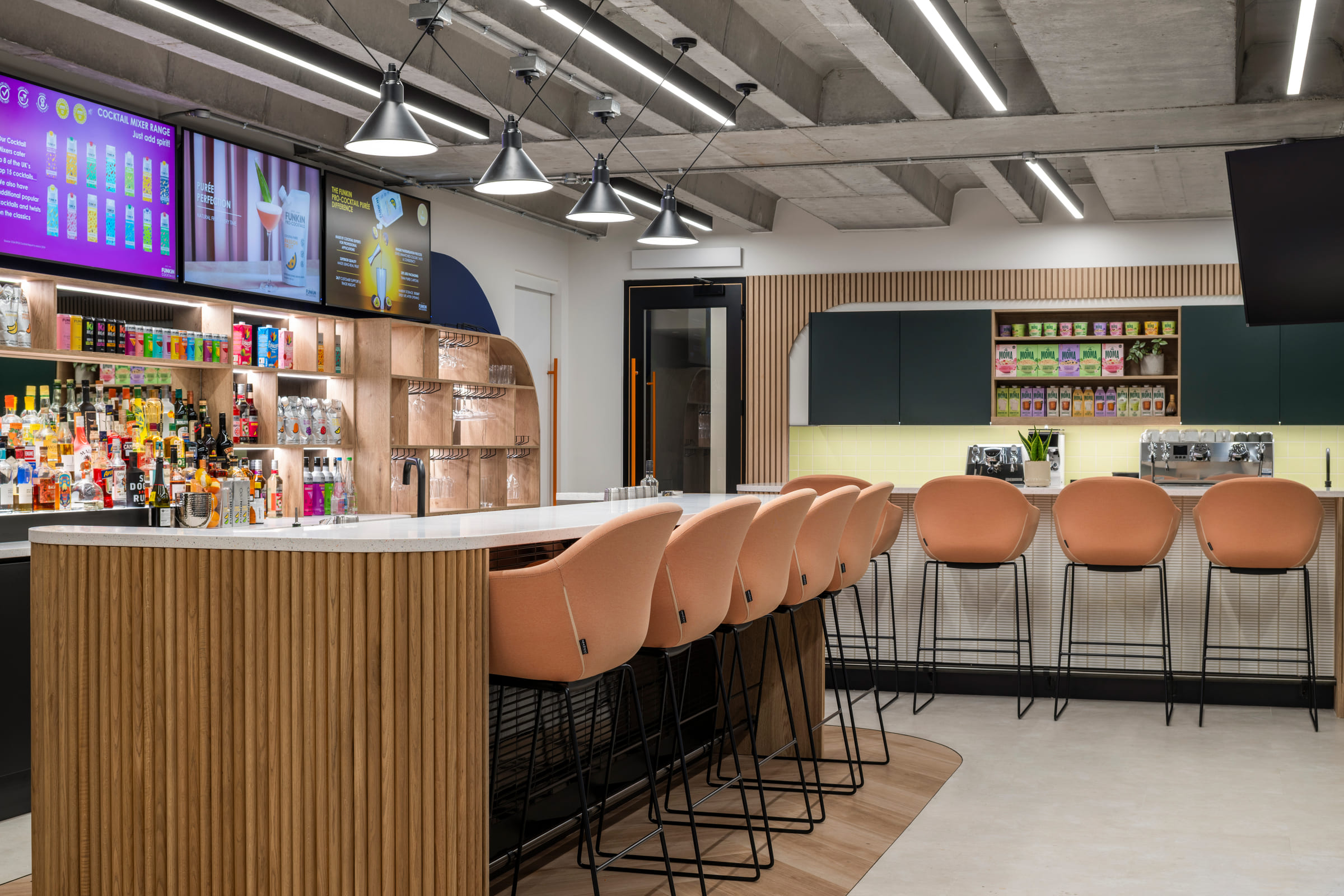 AG Barr London Hub — bar area with timber cladding and product displays
