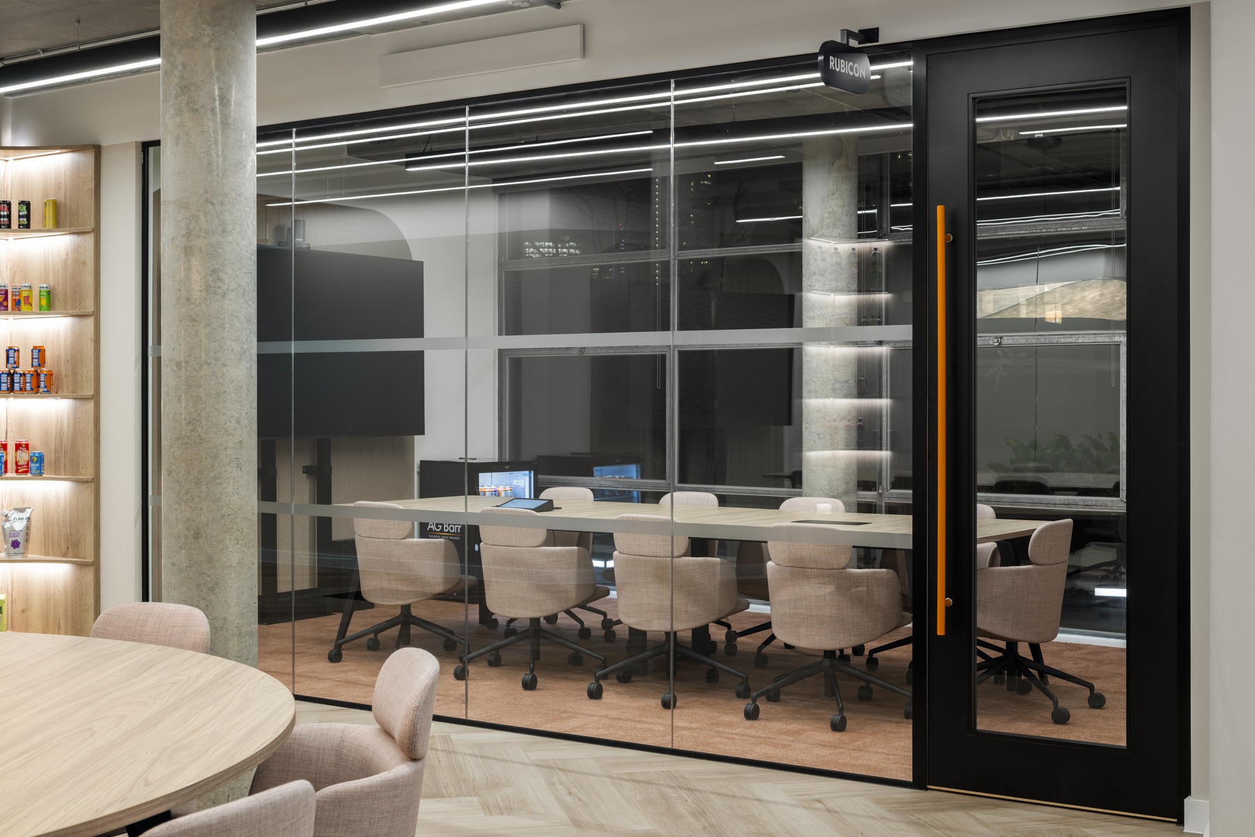 Meeting room through glass with product shelves
