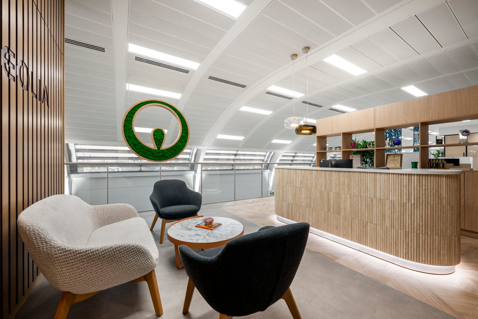 Veolia reception area with moss logo, timber slats and curved ceiling